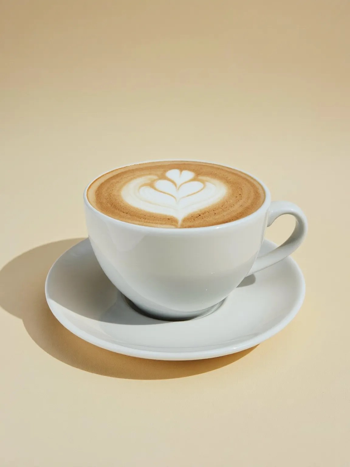 A cappuccino in a white cup and saucer