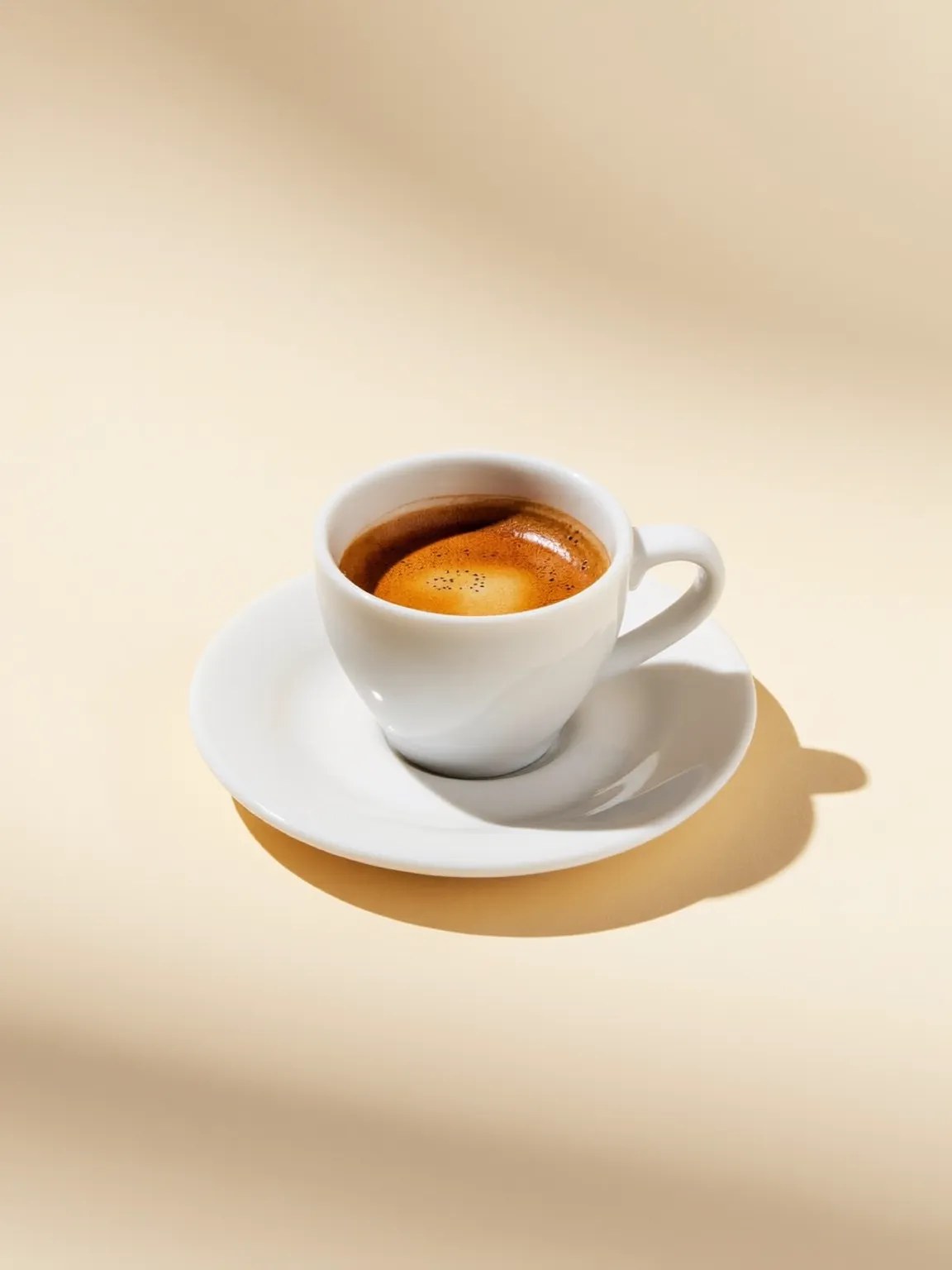 An espresso in a small white cup